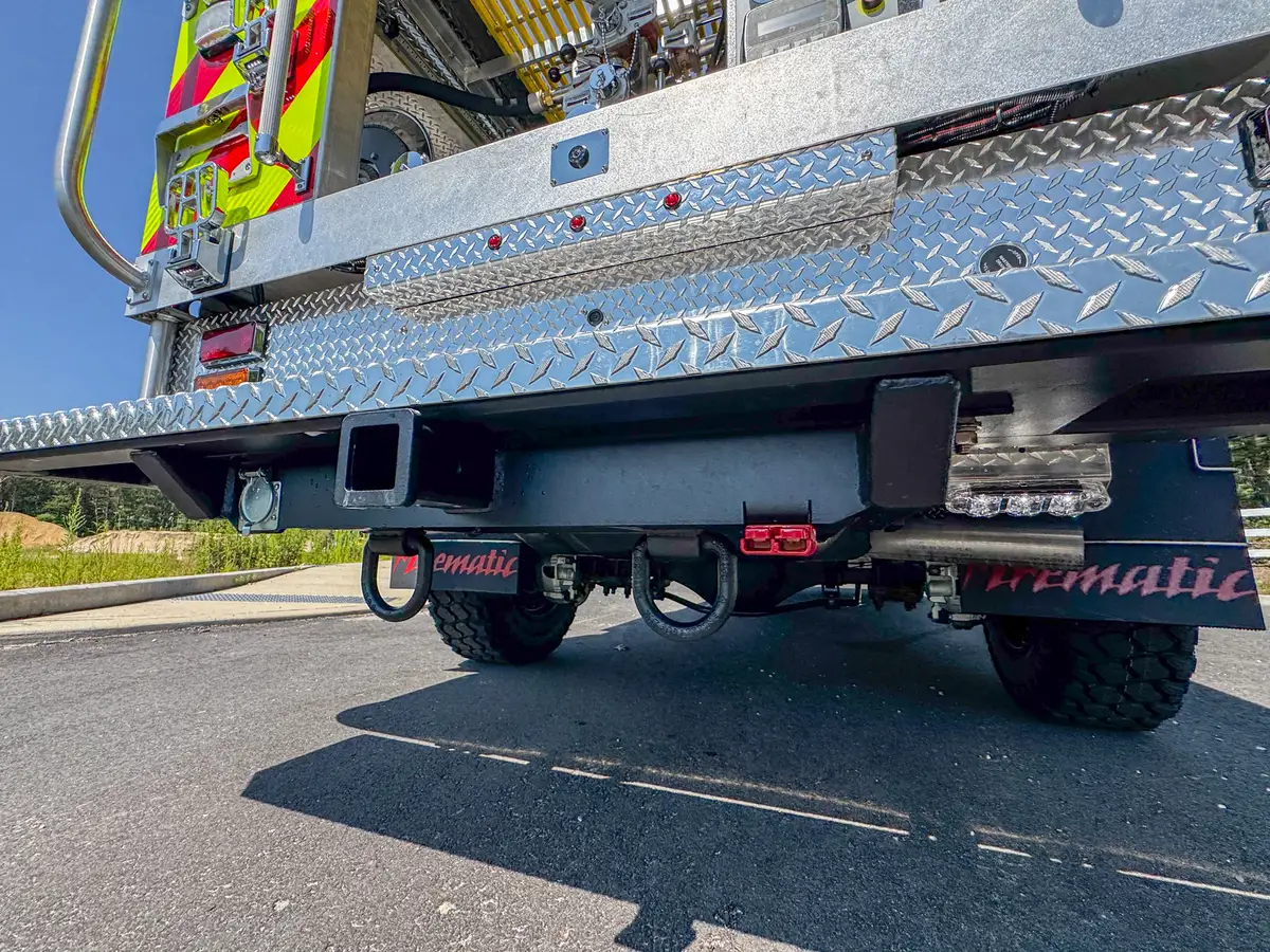 Rear corner latch and hinge close-up on chevron side panel.